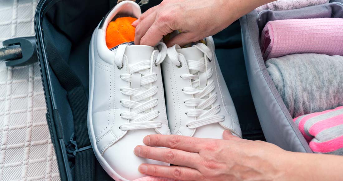 how to pack a suitcase - packing shoe
